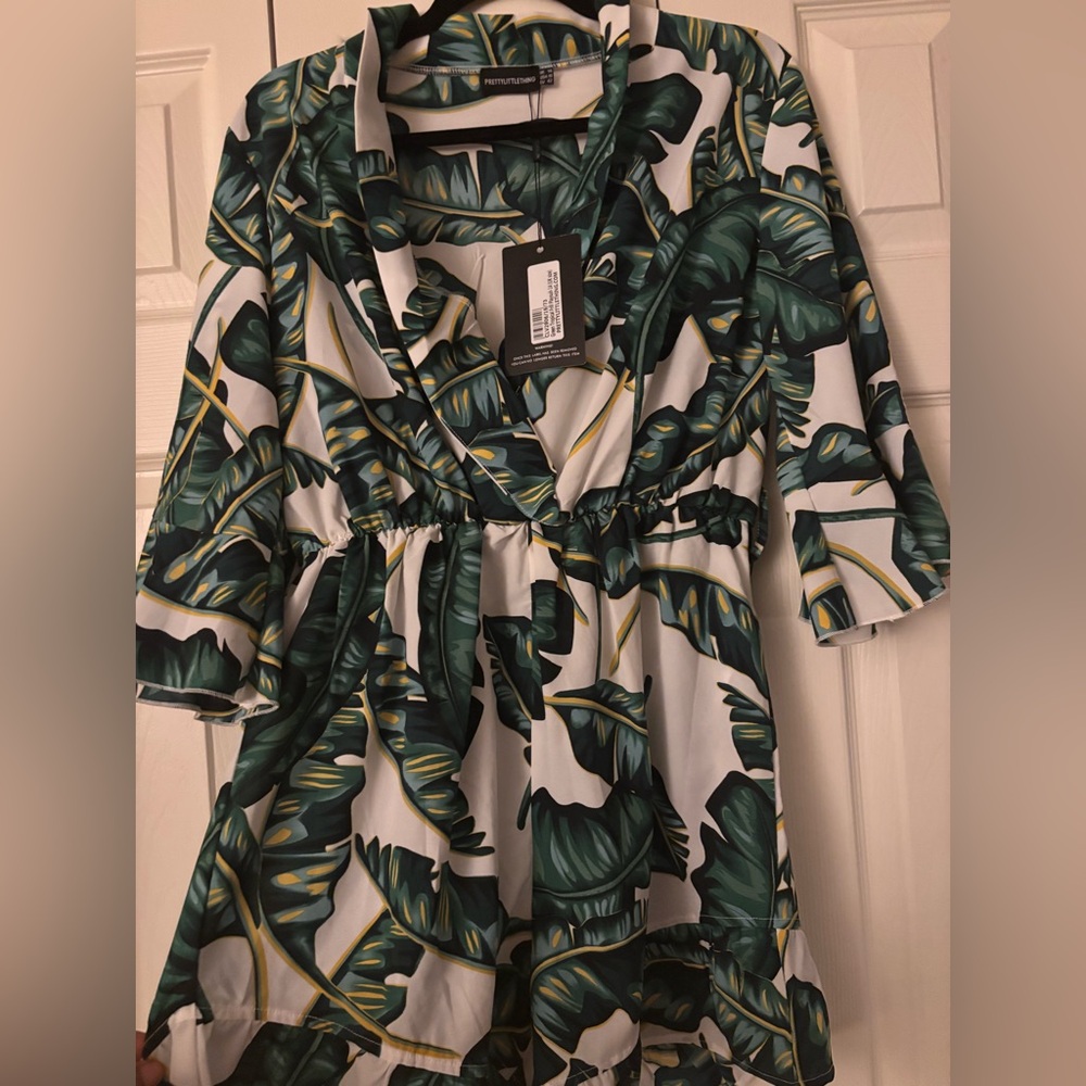 Pretty Little Thing GREEN TROPICAL FRILL ROMPER